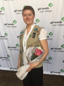Andy accepts the highest award in Girl Scouting.