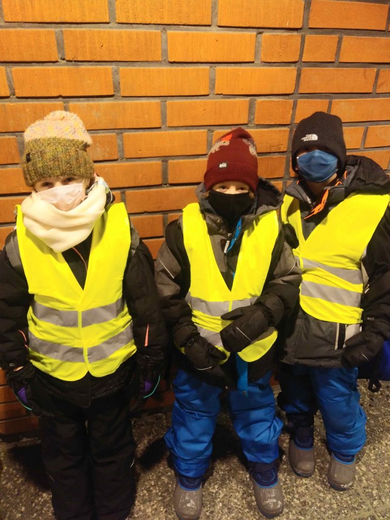 Waiting to go into the building.  We were wearing masks just in case, but none of the kids wear masks.